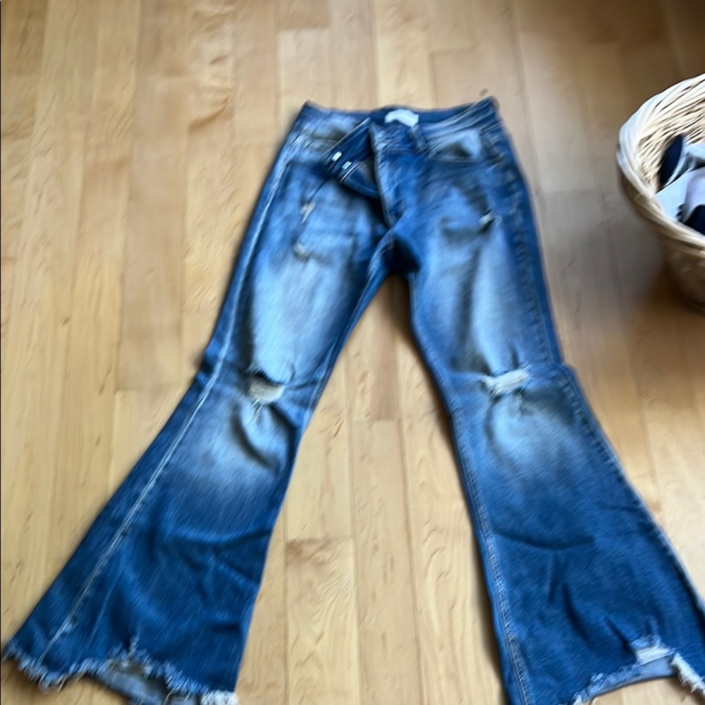 Blue Flare Leg Jeans with Distressed Details